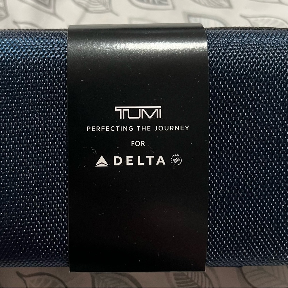 - SOLD Tumi x Delta toiletry bag